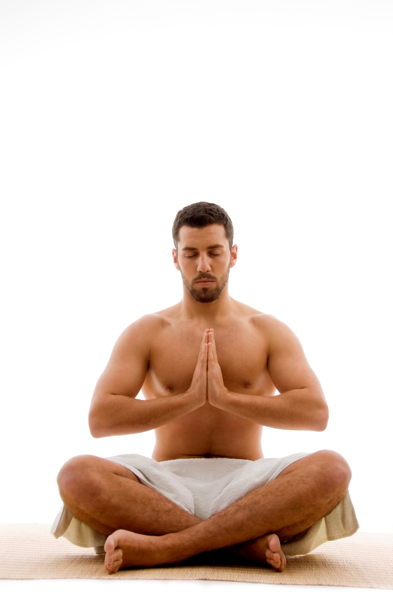 front view of man practicing yoga